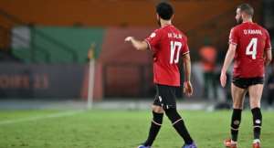 Egypt's Mohamed Salah walks off after picking up an injury against Ghana.  By Issouf SANOGO AFP