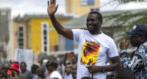 Sifuna drew roars of approval as he greeted supporters during a campaign rally in capital Nairobi.  By SIMON MAINA (AFP)