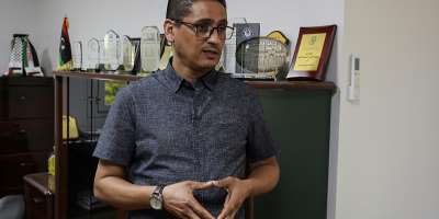 Ashraf Abu Rawi, spokesperson for Libyas teachers union, speaks with an AFP journalist at his office in Tripoli on September 27, 2026, during a teachers strike demanding higher salaries and better working conditions. — Mahmud Turkia / AFP