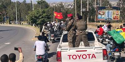 In this photo taken with a smartphone, soldiers participate in a procession welcoming former Tigray leader Getachew Reda in Mekelle, Ethiopia, October 11, 2026. - Filmon Equar Hailu, AP