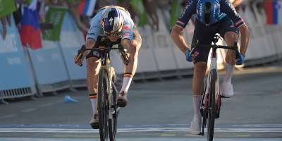 Remco Evenepoel (left) crosses the finish line to win ahead of Giulio Ciccone. - Jure Makovec, AFP