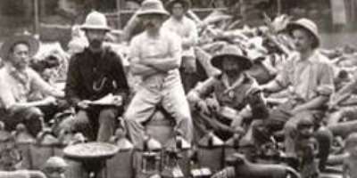 Members of the notorious British Punitive Exhibition of 1897 posing proudly with looted Benin ivories and bronze objects.