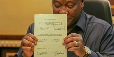 President Mahama signing bills into law