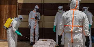 Health workers prepare the coffin of a university student who died of Ebola at the Citadelle Clinic in Bunia on June 12, 2026. -  Moses Sawasawa, AP