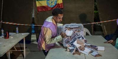 National Election Board of Ethiopia officials sort and count ballots at the Shalla Park polling station during the general election in Addis Ababa, Ethiopia, 2 June 2026.` -  Amanuel Sileshi/AP