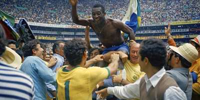 Brazil striker Pel, the only player to win the World Cup three times, was held aloft by teammates after inspiring Brazil to a 4-1 win over Italy in the 1970 World Cup final at the Estadio Azteca in Mexico City. - AP