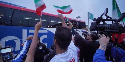 Supporters of the Iranian national team greet the players upon arrival in Tijuana, Mexico, on June 7, 2026. -  Victor Medina, Reuters