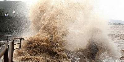 Huge waves crash on the coastline ahead of Typhoon Bavi in Wenling in eastern Chinas Zhejiang province on July 10, 2026. -  Chinatopix Via AP