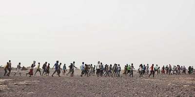 In this July 14, 2019 photo, smugglers lead Ethiopian migrants in Obock, Djibouti to embark on a route via Yemen to reach oil-rich Saudi Arabia to earn enough to escape poverty. - AP - Nariman El-Mofty