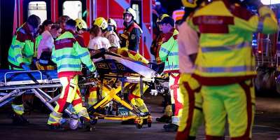 Emergency responders work onsite at Berlin Pride after a car crashed into the crowd at Tiergarten park, leaving several people injured on July 25, 2026. -  Christian Mang, Reuters