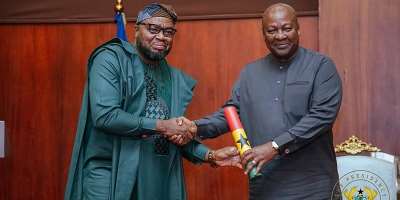Hon. Sukparu receiving his Instrument of Appointment from H. E. John Dramani Mahama