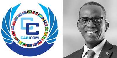 CARICOM logo and Philip J. Pierre, Prime Minister of Saint Lucia