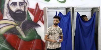A man prepares to cast his ballot at a polling station during parliamentary elections in Algiers on July 2, 2026. -  AFP