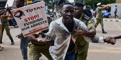 Police apprehend a Ugandan activist during a protest against the East African Crude Oil Pipeline (EACOP) plans in Kampala, Uganda, on 15 September, 2023. -  Reuters