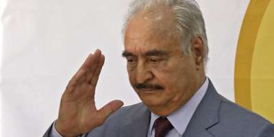 Libyas eastern military chief Khalifa Haftar waves after a speech at the local headquarters of the High National Election Commission in Benghazi on November 16, 2021. -  Abdullah Doma, AFP