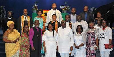 HE Papa Owusu Ankomah and His wife in a group photograph with the Clergy, Traditional rulers, as well as staff of the Ghana High Commission UK.