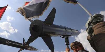 A Houthi supporter chants slogans as he carries a rocket replica during an anti-US and anti-Israel rally in Sana following Israeli airstrikes on September 26, 2025. -  Osamah Abdulrahman, AP