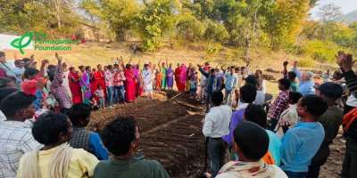 Community gathered around garden bed