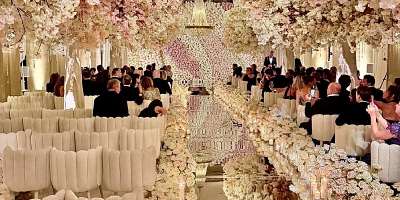 Alina Habba walked down a mirrored aisle flocked with florals. (Exclusive to The Correspondent.)
