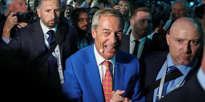 Britains Reform UK party leader Nigel Farage smiles before speaking at the Reform UK party conference, in Birmingham, Britain, September 4, 2026. - Temilade Adelaja, Reuters