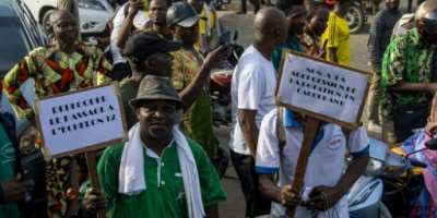 Demonstrators hold up placards during a march against the high cost of living in Cotonou, last April 27, 2024.  By Abadjaye Justin SODOGANDJI AFPFile