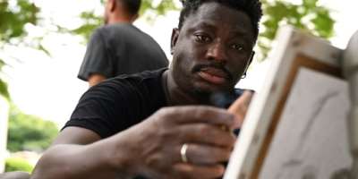 Despite the challenges facing black African painters Aboudia has become one of worlds top-selling artists.  By Issouf SANOGO (AFP)