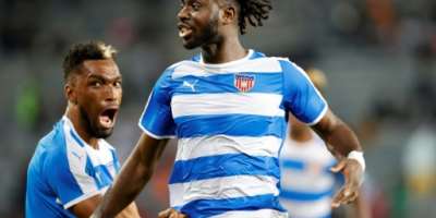 Level up: Mohammed Sangare R celebrates equalising for Liberia against South Africa in Soweto.  By PHILL MAGAKOE AFP
