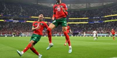 Moroccos policy of persuading dual nationals like Achraf Hakimi (L) to play for them has paid rich dividends.  By PATRICIA DE MELO MOREIRA (AFP)