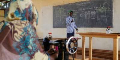 Sewing instructor Yonaba understands the trauma that still haunts his ex-child soldiers pupils.  By Mariam KONE (AFP)