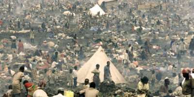 Tens of thousands of  Rwandan refugees pack into a makeshift camp just north Goma on July 17, 1994.  By Pascal GUYOT AFPFile