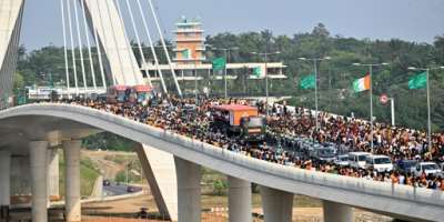 The Ivory Coast team, winners of the 2024 African Cup of Nations CAN, and supporters on the Alassane Ouattara bridge in Abidjan in February.  By Sia KAMBOU AFPFile