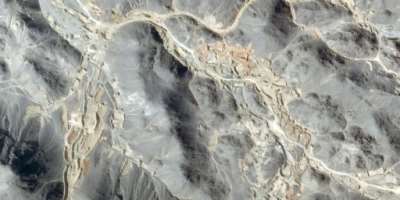 This handout satellite image taken by Planet Labs PBC on October 13, 2026 and provided on October 21, 2026, and analysed by AFP, shows a general view of excavation sites and earthworks at the location of artisanal gold mines in Jabal al-Uqaydat.  By - (2026 Planet Labs PBC/AFP)
