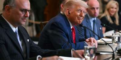 US President Donald Trump, flanked by US Senior Advisor for Africa Massad Boulo and White House Deputy Chief of Staff Stephen Miller, participates in a multilateral lunch with visiting African Leaders in the State Dining Room of the White House.  By Jim WATSON (AFP/File)