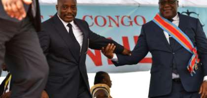 During his inauguration DR Congo's new president, Felix Tshisekedi, (R) walks off the podium with outgoing leader Joseph Kabila in Kinshasa in January 2019. By TONY KARUMBA (AFP/File)