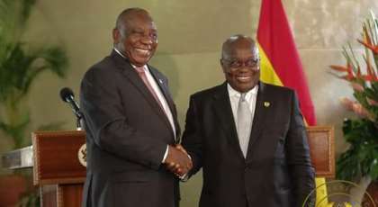 The two Presidents in a handshake after the signing ceremony