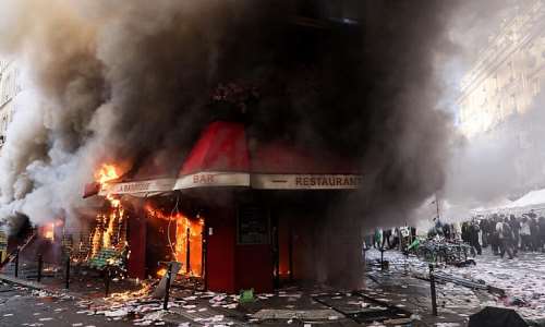 Masked youths clashed with police and fires were set in several cities, including Paris. -  Kiran Ridley, AFP