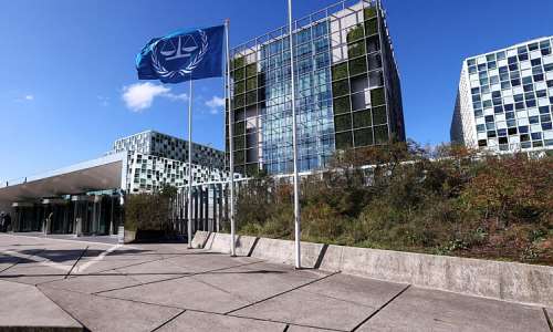People stand outside the International Criminal Court (ICC) in The Hague, Netherlands on September 22, 2025. -  Piroschka Van De Wouw, Reuters