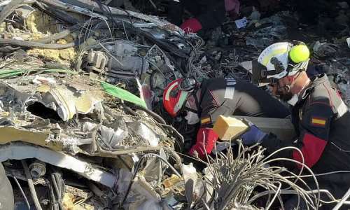 Ths still image from video taken and released by Spains Emergency Military Unit (UME) on October 28, 2026 shows military rescue personnel working at the scene of a train crash between a high speed Renfe AVE train and Iryo train around 150kms south of Madrid between Urda and Los Yebenes in the province of Toledo. -  AFP