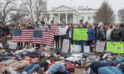 People protest gun violence outside the White House on Feb. 19 following the latest mass school shooting, this one in Florida. Like the teens and children who showed up at the White House and elsewhere to protest, Americans must rediscover themselves as a revolutionary people who are not afraid to start over. Shutterstock