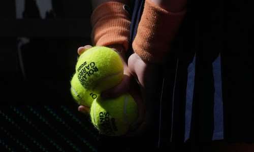 A ballgirl stands during the draw for the French Open tennis tournament, Thursday, May 21, 2026, at the Roland Garros stadium in Paris. -  Thibault Camus, AP Photo