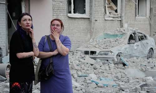 Kyiv residents examine the destruction from a Russian missile strike on an apartment building on July 2, 2026. -  Efrem Lukatsky, AP