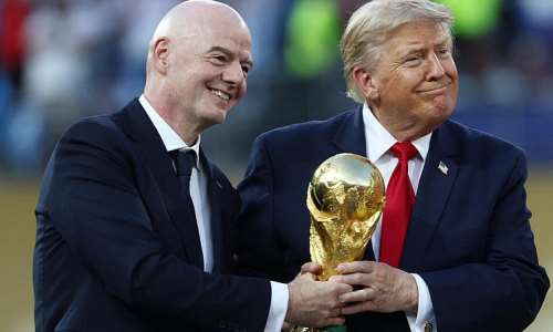 US President Donald Trump and FIFA President Gianni Infantino hold the World Cup trophy. -  Mark J Rebilas, Reuters
