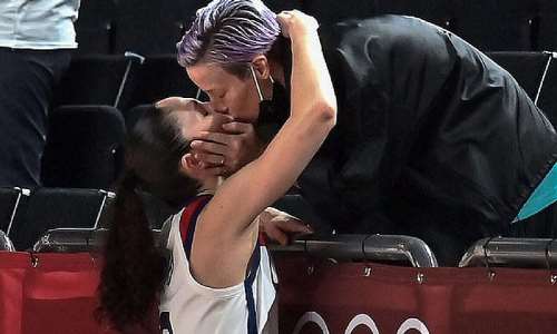 Women's basketball captain Sue Bird shared a kiss with her soccer great fiancée Megan Rapinoe after the US led her team to gold