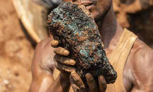 An artisanal miner holding a cobalt stone at the Shabara artisanal mine near Kolwezi, in Katanga, in October 2022. -  AFP/Junior Kannah