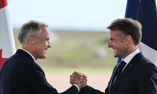 French President Emmanuel Macron (R) and Canadian Prime Minister Mark Carney (L) hold a joint press statement in Saint-Pierre on September 20, 2026. -  Ludovic Marin, AFP