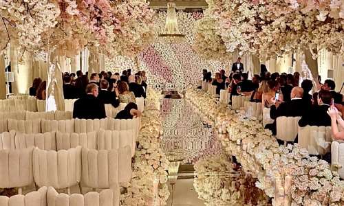 Alina Habba walked down a mirrored aisle flocked with florals. (Exclusive to The Correspondent.)
