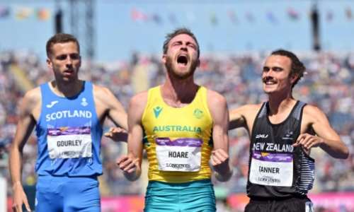 Australia's Oliver Hoare centre celebrates victory in the final of the men's 1500m at the Commonwealth Games. By Glyn KIRK AFP