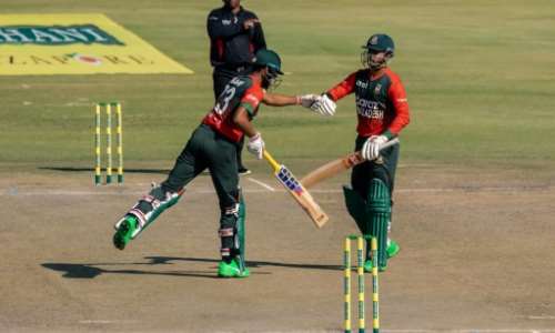 Bangladesh opening batsmen Mohammad Naim (L) and Soumya Sarkar (R) fist bump during a 102-run first-wicket stand in a Twenty20 international against Zimbabwe in Harare on Thursday. By Jekesai NJIKIZANA (AFP)