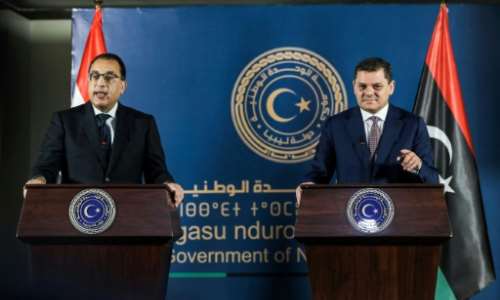 Egyptian Prime Minister Mostafa Madbouli, left, and interim Libyan Prime Miniser Abdulhamid Dbeibah hold a joint press conference in the capital Tripoli. By Mahmud Turkia (AFP)