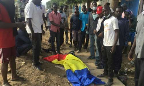 Fatal protest: A body covered by a Chadian flag after the October 20 unrest. By - AFPFile